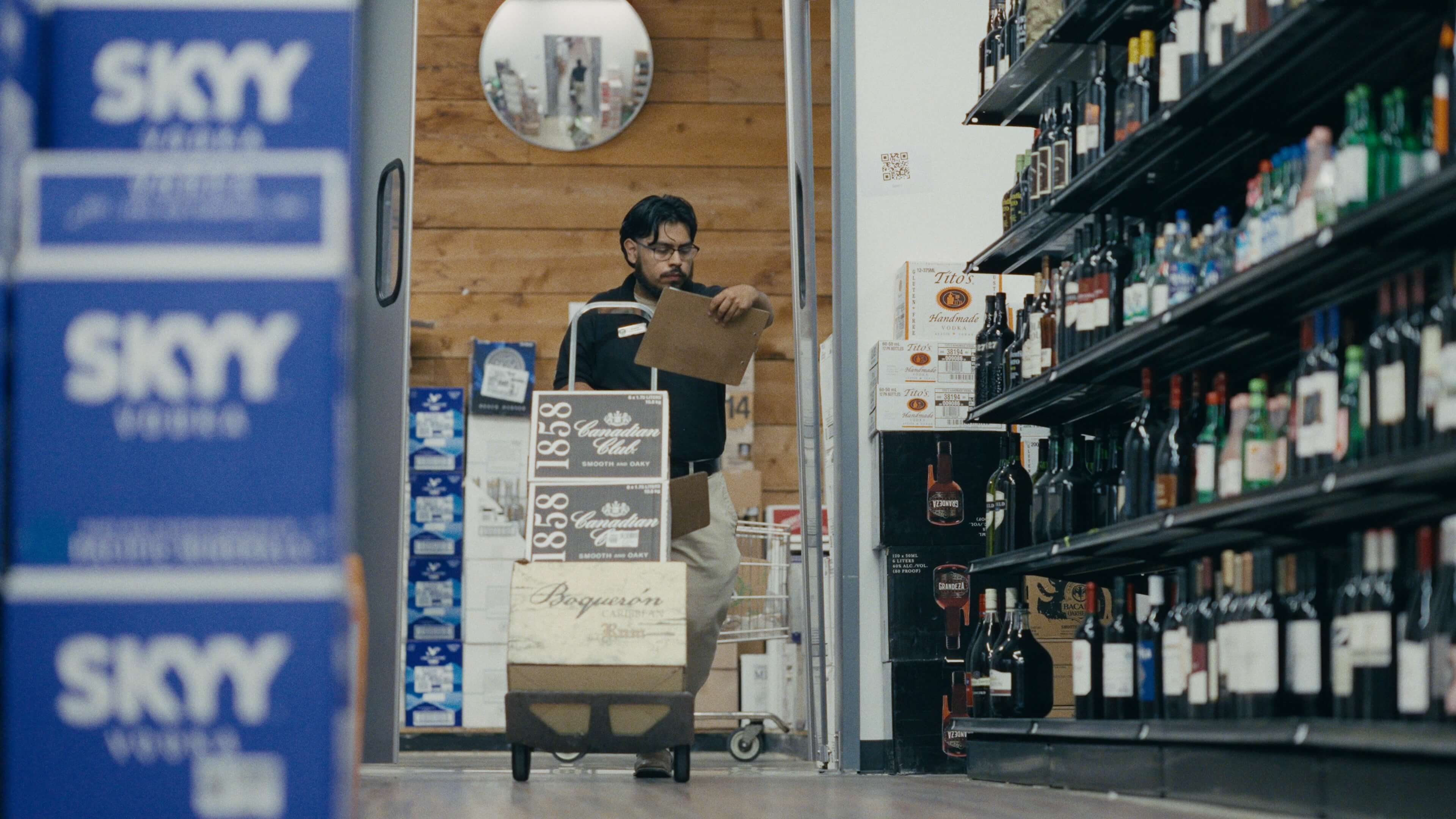 Pio cube storage grid holding wine and spirits in a compact retail backroom