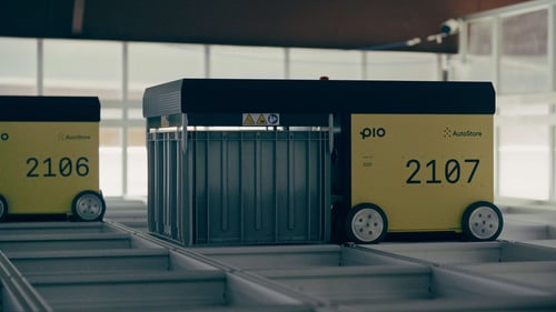 Pio robots retrieving every item in a customer's in-store order from the cube storage grid