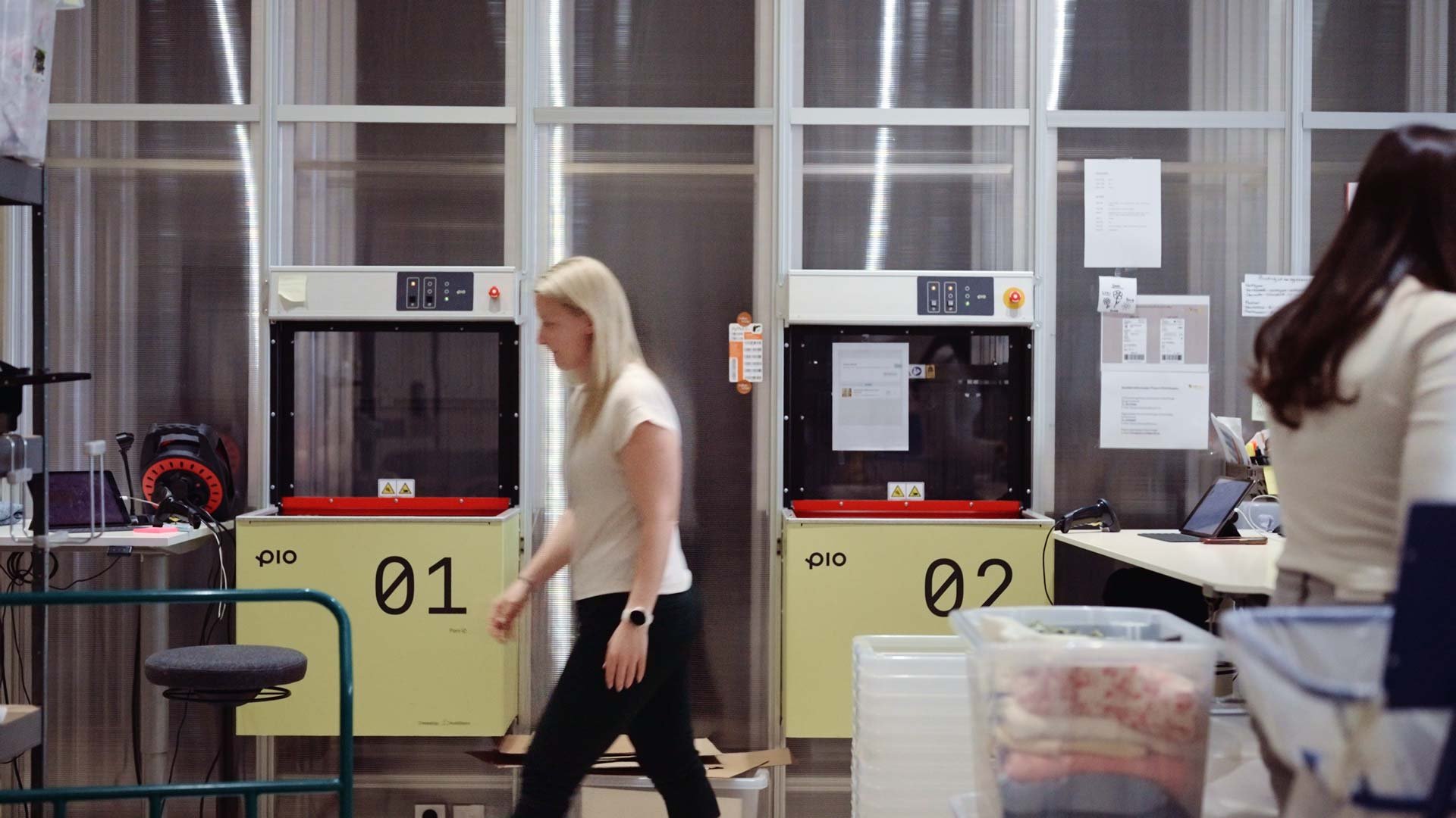 Employee picking ecommerce and retail orders from Pio warehouse automation port, ensuring next-day shipping and high accuracy.